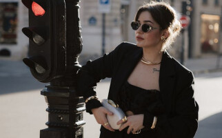 woman wearing a black outfit and sunglasses