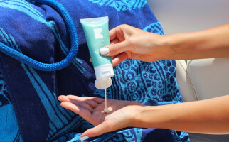 woman applying sunscreen
