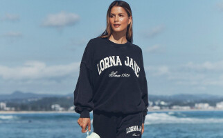 Woman wearing Lorna Jane sweatshirt