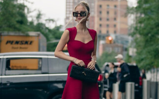 woman wearing a red dress and black sunglasses