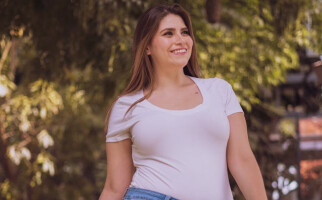 woman wearing a white tshirt and jeans
