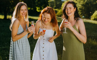 three women in dresses