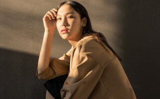 woman wearing a beige shirt