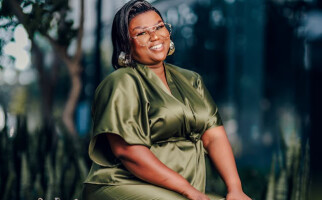 woman wearing a green jumpsuit