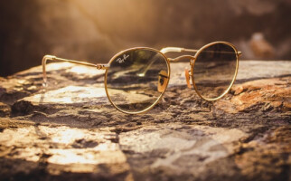 ray-ban sunglasses on a rock