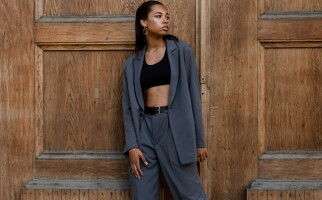 Woman wearing a dark grey blazer set
