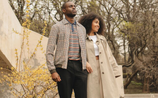 Two people standing beside each other wearing outerwear