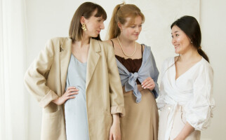 Group of friends wearing business casual clothing standing beside each other